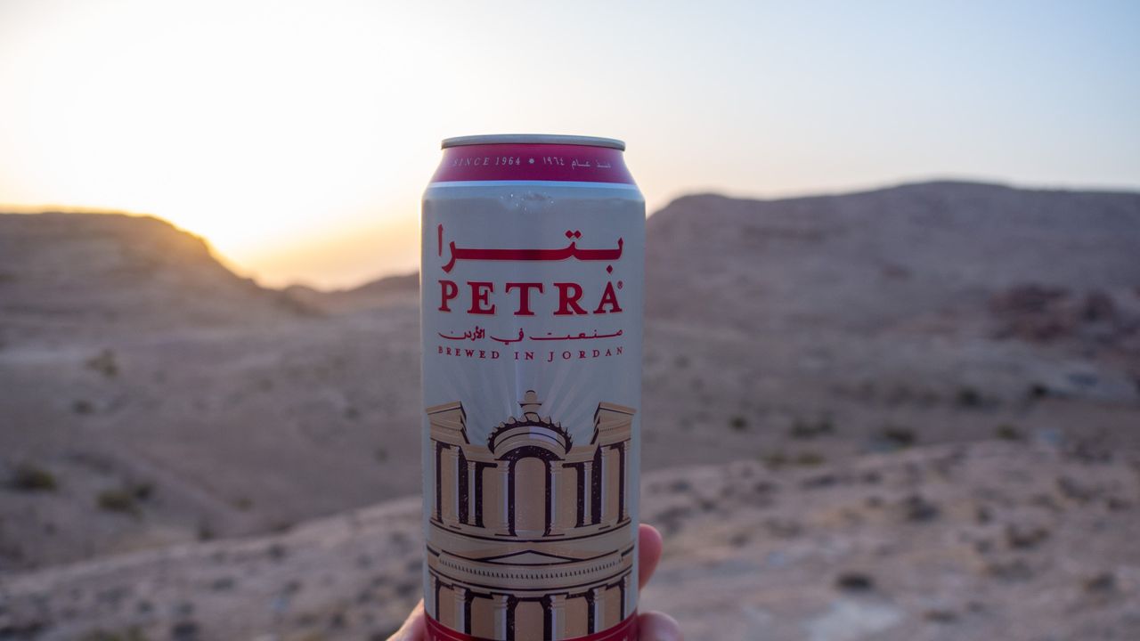 Petra beer in front of a sunset in the sand dunes desert