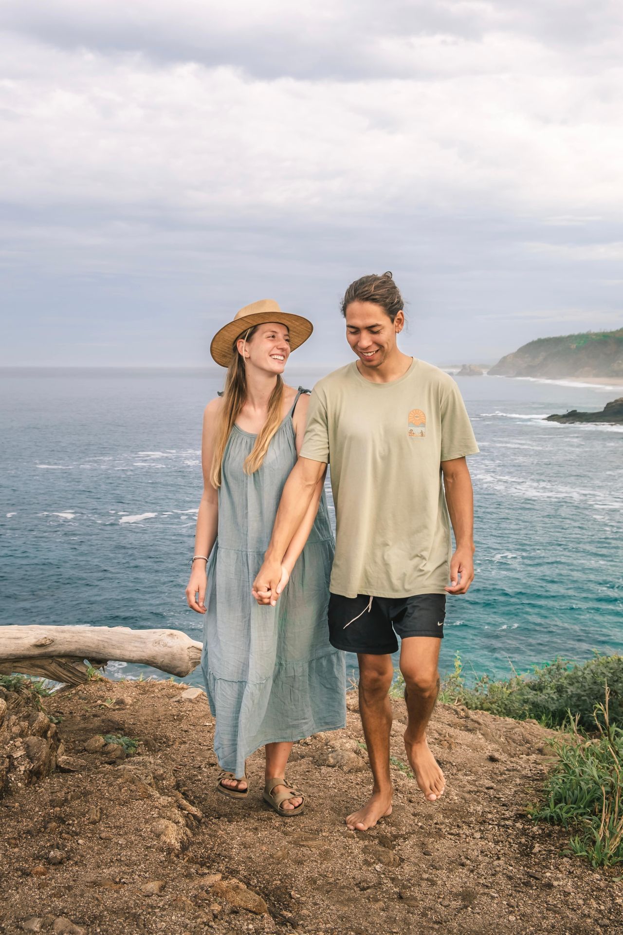 Mark and Lison on a cliff with the ocean in the background