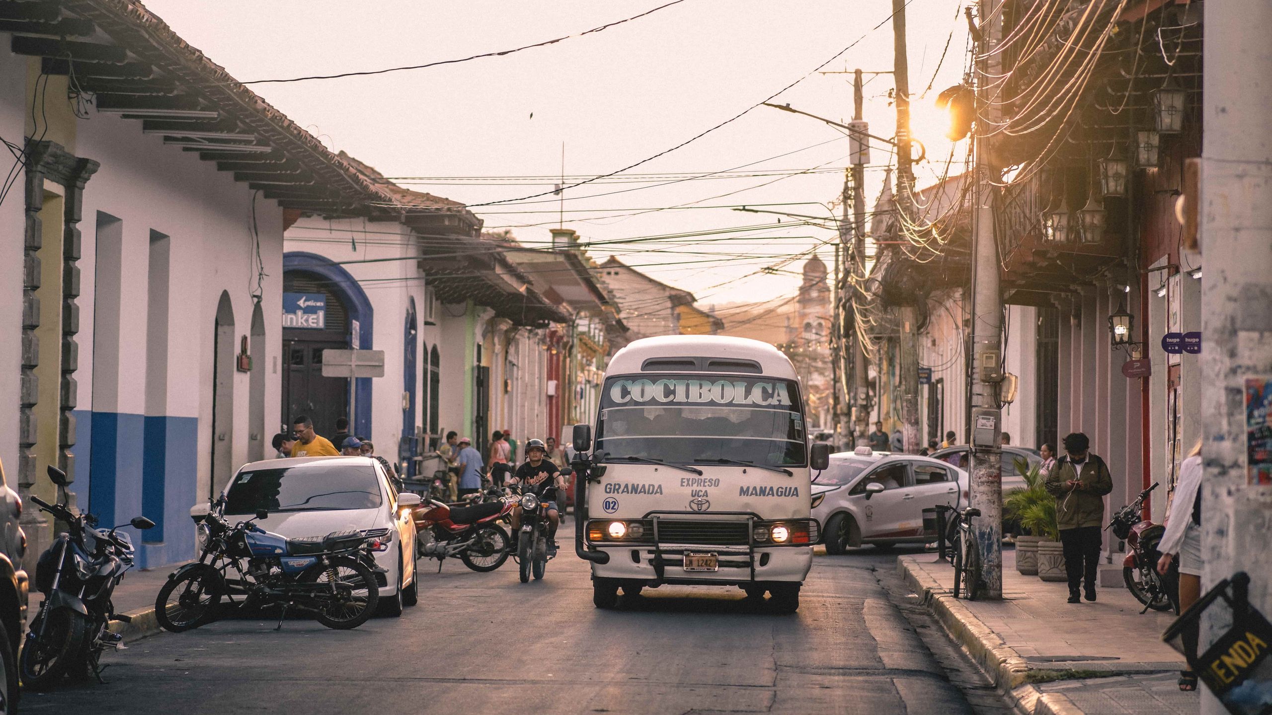 Bus driving in a busy street of Granada, Nicaragua