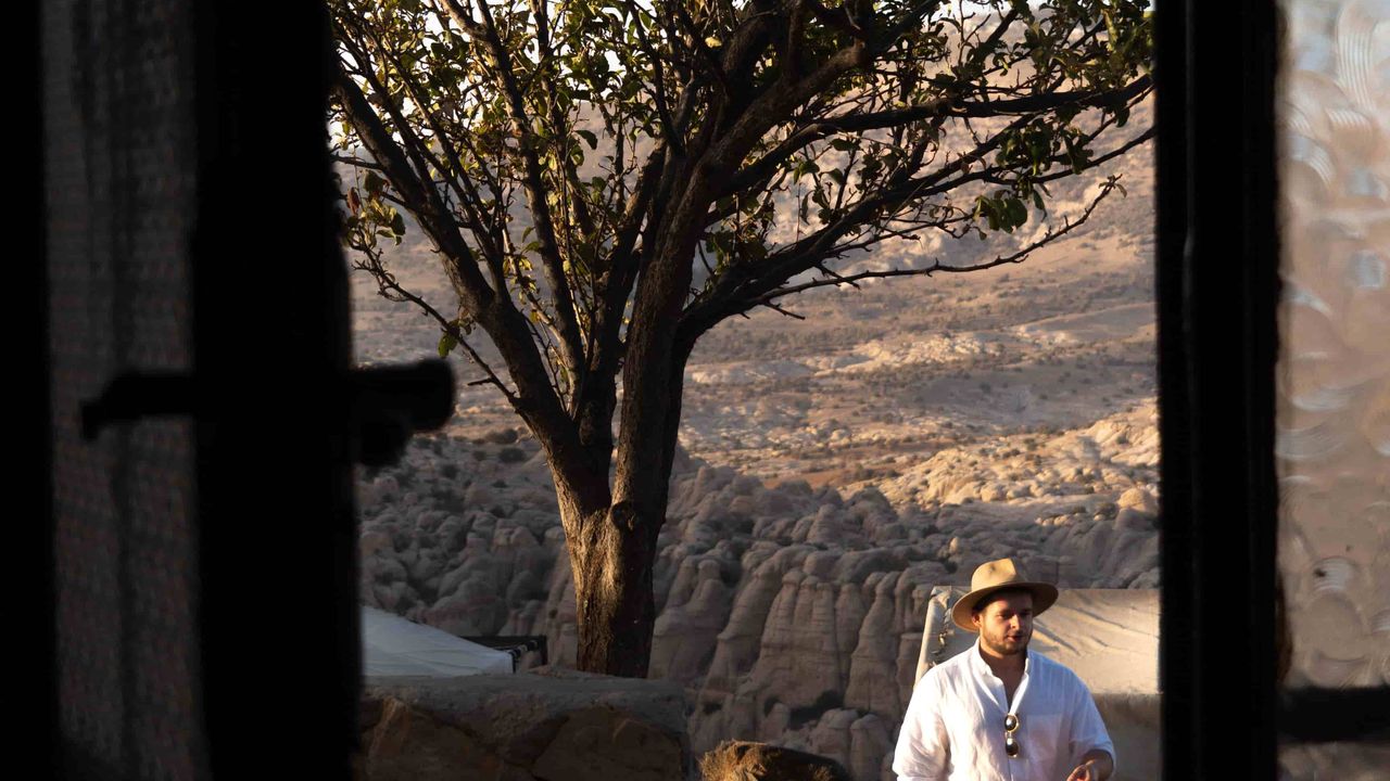 A man walking toward a door in Dana Reserve