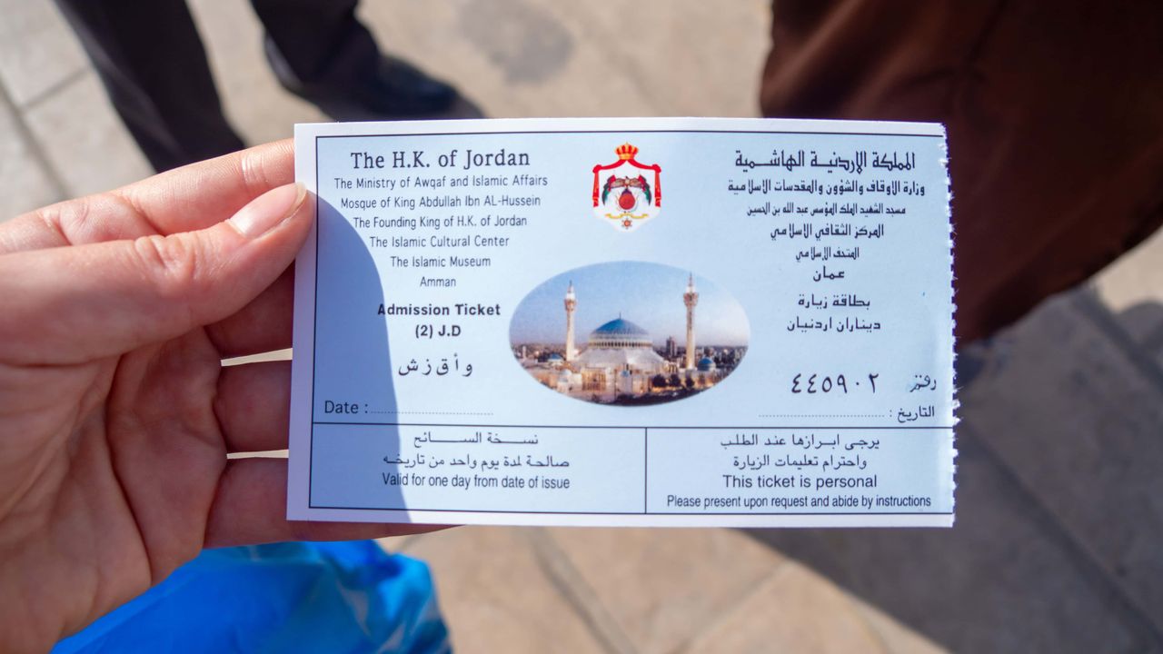 Focus on a entrance ticket to the blue mosque in Amman, Jordan