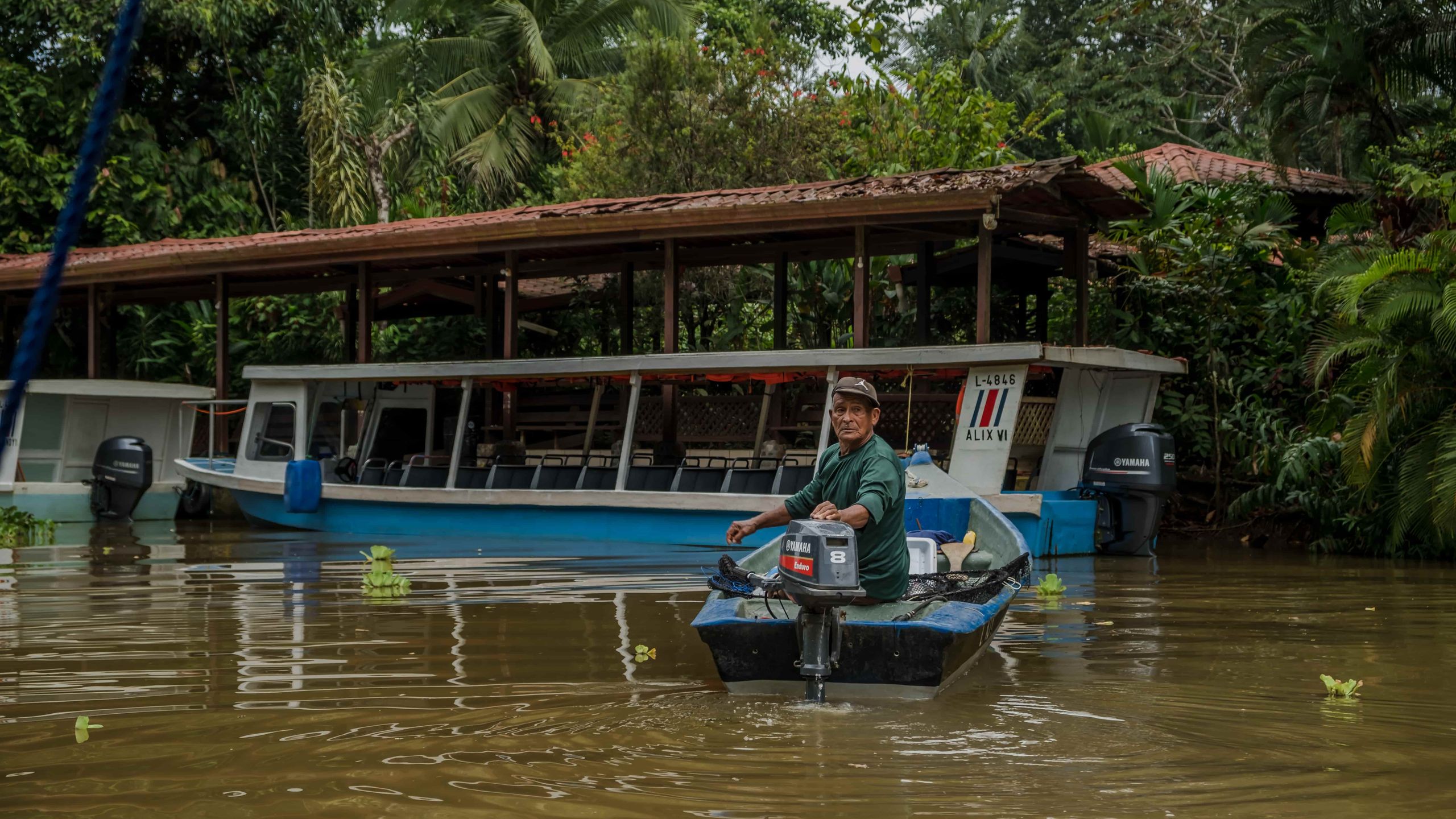 Fisherman in his boat on a river